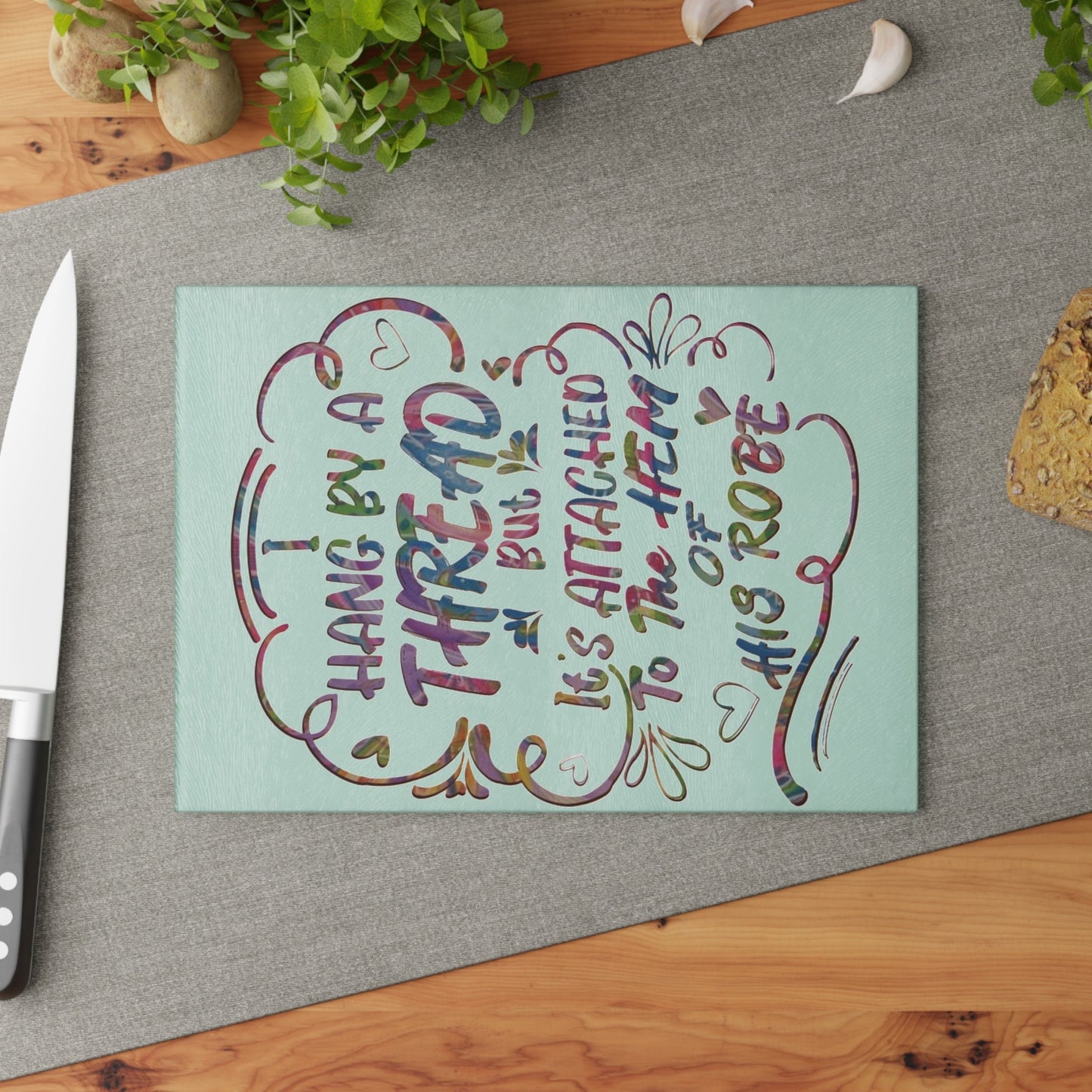 Hanging on to his Robe inspirational Glass Cutting Board