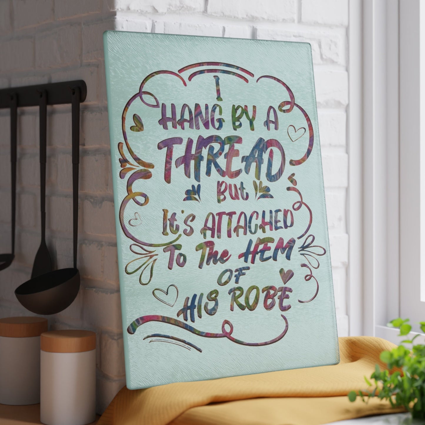 Hanging on to his Robe inspirational Glass Cutting Board